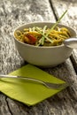 Delicious freshly cooked pasta with pesto sauce decorated with g