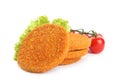 Delicious fried breaded cutlets with cherry tomatoes and lettuce on white background Royalty Free Stock Photo