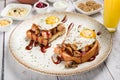 Delicious Fried Breakfast Eggs on White Plate, Traditional Tasty Toast with Bacon and Sauce, Gourmet Cuisine Royalty Free Stock Photo