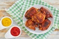 Delicious fried chicken thigh on white plate on table cloth Royalty Free Stock Photo