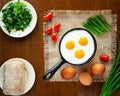 Delicious fried eggs in a hot pan Royalty Free Stock Photo