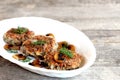 Delicious fried mushroom cutlets on a plate and wooden table. Healthy vegetarian cutlets. Mushroom dish. Homemade food photo Royalty Free Stock Photo