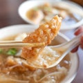 Delicious fried narrow-barred Spanish mackerel fish fillet with rice and noodles in thick soup in Taiwan