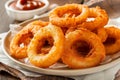 Delicious fried onion rings with dipping sauce