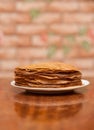 Delicious fried pancakes on wooden table