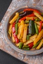 Delicious fried potatoes with bell peppers, asparagus beans, salt and spices