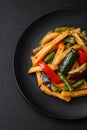 Delicious fried potatoes with bell peppers, asparagus beans, salt and spices