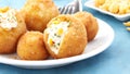 Delicious fried rice balls filled with mozzarella cheese, meat, and pea Ai Generated
