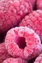 Delicious frozen raspberries close up