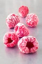 Delicious frozen raspberries on steel