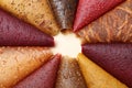 Delicious fruit leather rolls on beige background, closeup