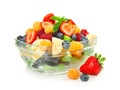 Delicious fruit salad in glass bowl on white background Royalty Free Stock Photo