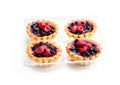 Delicious fruit tarts in plastic pack isolated on white Royalty Free Stock Photo