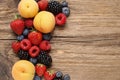 Delicious fruits: strawberry, peach, raspberry, blueberry and blackberry