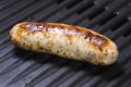 Delicious german sausages on the barbecue electro grill. Tasty sausages sizzling on a portable electric grilling on a summer