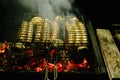 Delicious german sausages sizzling over the coals on barbecue grill