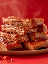 Delicious Glazed Barbecue Pork Ribs Stack on Plate with Vibrant Red Background, Meaty Dinner Dish Concept