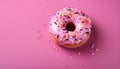 Delicious glazed donut with colorful sprinkles on vivid pink background