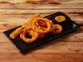 Delicious golden battered, breaded and deep fried crispy onion rings Royalty Free Stock Photo