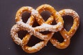 Delicious golden brezel with shiny crust sprinkled with sugar