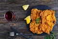 Wiener schnitzel with glass of red wine Royalty Free Stock Photo