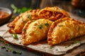 Delicious Golden Brown Empanadas with Meat Filling and Fresh Parsley on a Rustic Background