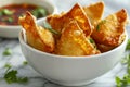 Delicious Golden Brown Fried Samosas in Bowl with Fresh Cilantro and Dipping Sauce on Marble Surface