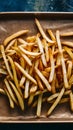 Delicious golden fries arranged on a kraft baking sheet