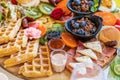 Delicious gourmet breakfast charcuterie board with waffles, fruits, and oatmeal Royalty Free Stock Photo