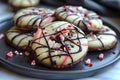 Delicious Gourmet Chocolate Drizzled Cookies with Sprinkles Served on a Dark Plate for Dessert or Sweet Snack, Close Up View for