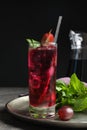 Delicious grape soda water with mint on grey table. Refreshing drink