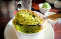 Delicious green tea souffle on table