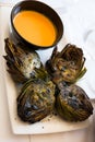 Delicious grilled artichoke halves Royalty Free Stock Photo