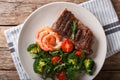 Delicious grilled beef steak with prawns and broccoli, tomatoes, arugula closeup on a plate. Surf and Turf. horizontal top view Royalty Free Stock Photo