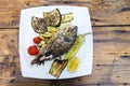 Delicious Grilled bream or dorade fish on wooden background