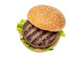 Delicious grilled burger with fresh lettuce and sesame seed bun Royalty Free Stock Photo