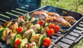 delicious grilled chicken meat shish kebob or kabob with vegetables on barbecue grill with smoke and flames. popular outdoor Royalty Free Stock Photo