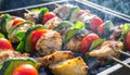 delicious grilled chicken meat shish kebob or kabob with vegetables on barbecue grill with smoke and flames. popular outdoor Royalty Free Stock Photo