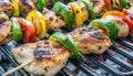 delicious grilled chicken meat shish kebob or kabob with vegetables on barbecue grill with smoke and flames. popular outdoor Royalty Free Stock Photo