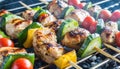 delicious grilled chicken meat shish kebob or kabob with vegetables on barbecue grill with smoke and flames. popular outdoor Royalty Free Stock Photo