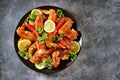 Delicious grilled chicken wings with lemon juice and chili pepper on gray concrete background. Top view. Copy cpace. Royalty Free Stock Photo