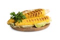 Delicious grilled corn cobs with parsley and lime on white background Royalty Free Stock Photo