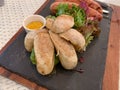 Delicious grilled german sausages with mustard sauce and salad