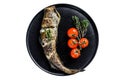 Delicious grilled hake with fresh thyme and tomatoes. Isolated, white background.