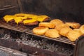 Delicious grilled hamburgers cooking on a barbeque. shot with selective focus