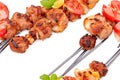 Delicious grilled kebabs on skewers on white background