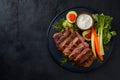 Delicious grilled meat served with fresh vegetables in foodgraphy