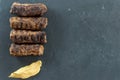 Delicious grilled minced meat rolls mici ori mititei traditional romanian and balkan dish served with mustard on a black slate Royalty Free Stock Photo