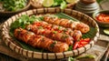 Delicious Grilled Sausages Seasoned with Fresh Herbs, Spices, and Chili Peppers on Rustic Wooden Table with Lime and Dipping Sauce Royalty Free Stock Photo