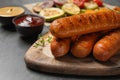 Delicious grilled sausages with thyme on grey , closeup. Space for text Royalty Free Stock Photo
